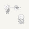 A pair of sterling silver ear studS with a butterfly design, featuring cubic zirconia and an imitation pearl.