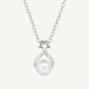 A sterling silver necklace with a silver plated and e-coated finish, featuring a white imitation pearl pendant, presented on a chain.