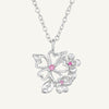 A sterling silver necklace with a cluster of flower and leaf shapes adorned with sparkling cubic zirconia, attached to a silver chain.