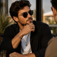 Man wearing sunglasses and jewelry, with text about using jewelry for confidence.